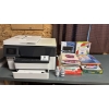 Image 1 : HP OfficeJet Pro 7740 and various paper supplies